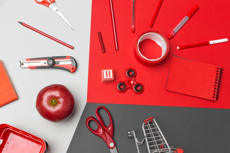 school supplies at colorful paper backgroundの写真素材