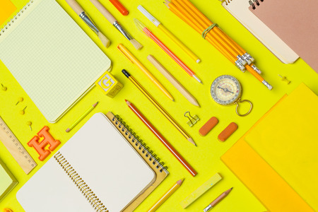 school supplies at colorful paper backgroundの写真素材