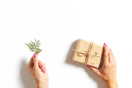 Woman's hands wrapping a giftの写真素材