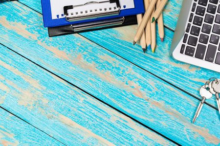 Wood desk with laptop and office supplies. Top viewの写真素材