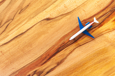 Toy of passenger plane on wooden backgroundの写真素材