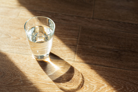 Glass of water on tableの写真素材