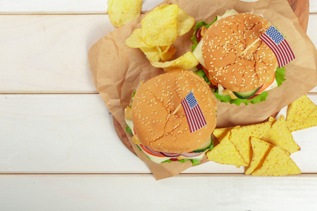 Fast food, homemade burger on a wooden backgroundの写真素材