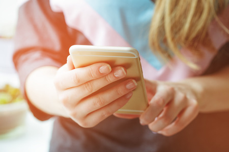 Woman typing write message on smart phoneの写真素材