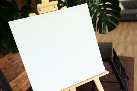 Wooden easel in the roomの写真素材