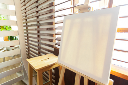 Wooden easel in the roomの写真素材