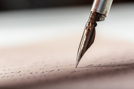 Fountain pen on an antique handwritten letterの写真素材