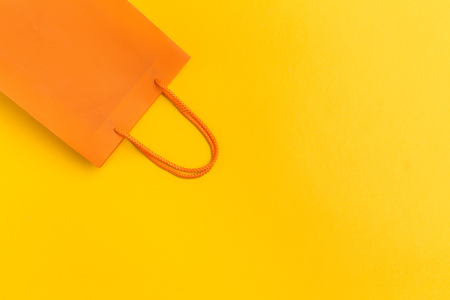 paper shopping bag on colorful background