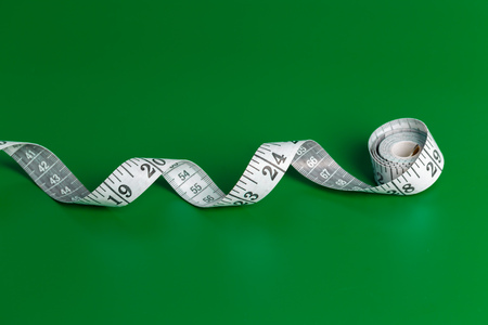 measure tape on a green backgroundの写真素材