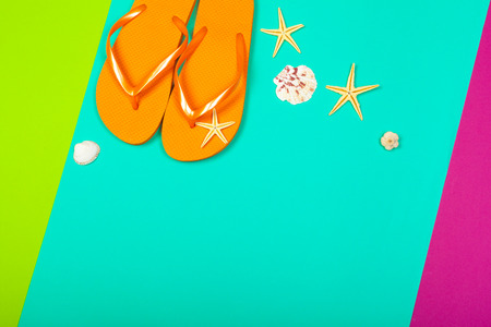 Beach flip flop on color backgroundの写真素材