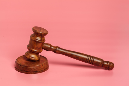 Judge gavel or auction on pink background. Justice and auction.の写真素材