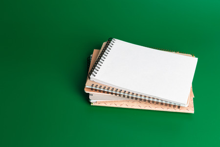 notebook on green backgroundの写真素材