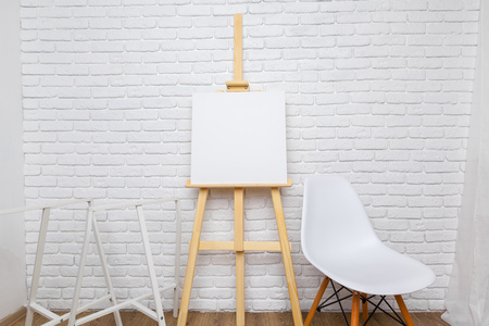 Wooden easel in the roomの写真素材