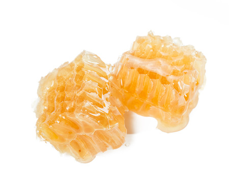 Sweet honeycomb isolated on whiteの写真素材
