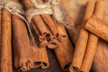 Cinnamon on wooden board.