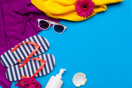 Beachwear and accessories on a blue background