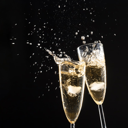 Glasses of champagne with splashの写真素材