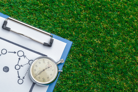 Silver chronometer on green grassの写真素材