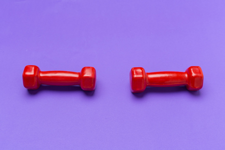 dumbbells on a color backgroundの写真素材