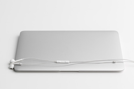 Music concept - Headphones over laptop