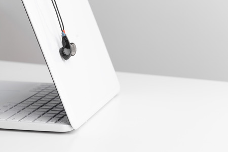 Music concept - Headphones over laptopの写真素材