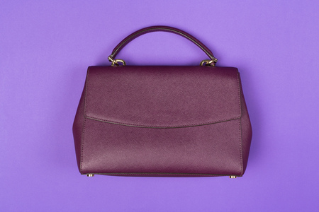 Woman's handbag purse close up top view on colored backgroundの写真素材