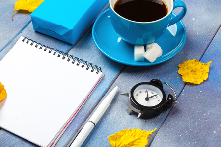 Modern workplace with cup of coffee on wooden tableの写真素材
