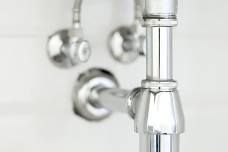 Water pipe under sink on White backgroundの写真素材