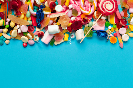 colored candies on blue backgroundの写真素材