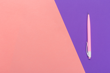 Top view of  ballpoint pen  on colored background