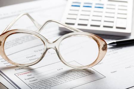 Close up shot of Eyeglasses  on document papers business concept