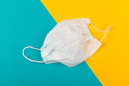 Protective face mask  on colored background