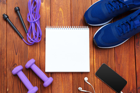 Fitness concept with sneakers, dumbbellsの写真素材