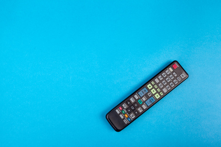 Tv set remote control on blue background top viewの写真素材