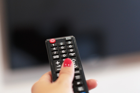 Watching TV and using remote controller
