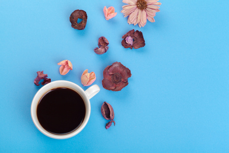 Cup of coffee on a blue tableの写真素材