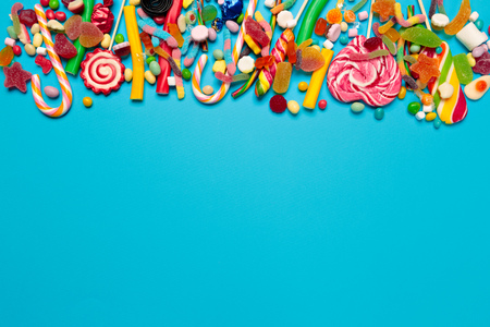 colored candies on blue backgroundの写真素材