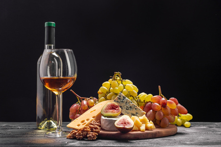Wine and cheese on the tableの写真素材
