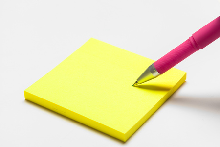 Blank memo pad note with pen close upの写真素材