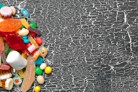 Colorful candies on old backgroundの写真素材