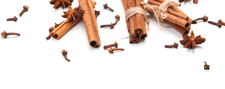 Cinnamon sticks and star anise isolated on white backgroundの写真素材