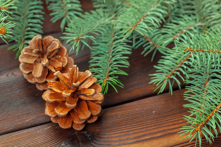 Christmas composition with fir tree branches on wooden background.の写真素材