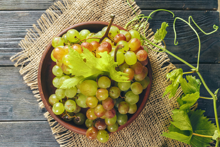 Grapes on a wooden tableの写真素材