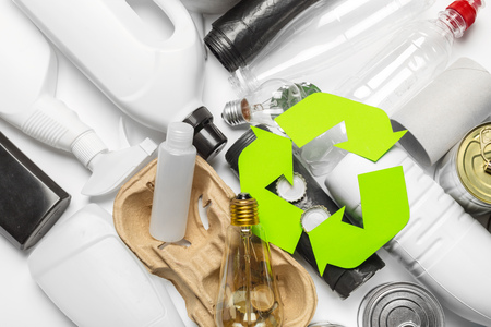 Eco concept with recycling symbol on table background top view