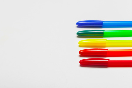 different colors pens isolated on the white backgroundの写真素材