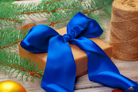 Christmas decoration, gift box and pine tree branches on wooden backgroundの写真素材