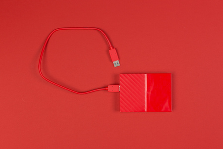 Red external harddrive disk on colored backgroundの写真素材
