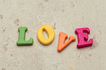 Word Love written in colorful plastic letters close up shotの写真素材