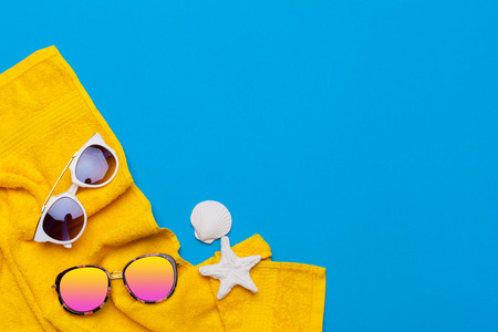 Beachwear and accessories on a blue backgroundの写真素材