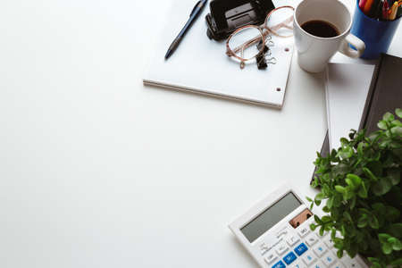 Business Items dropped in creative Disorder on white Tableの写真素材